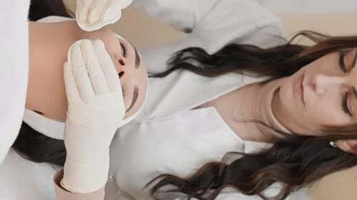 Disclosure of Natural Beauty in the Beauty Clinic the Cosmetologist Focuses on Cleansing Face