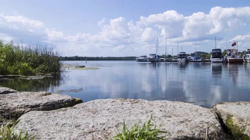 Boats and Clouds In Marina On Nice Day Timelapse