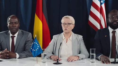 Caucasian Female Government Official Speaking at International Summit