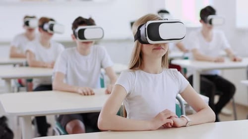 Students in Classroom Wearing VR Headsets for Education