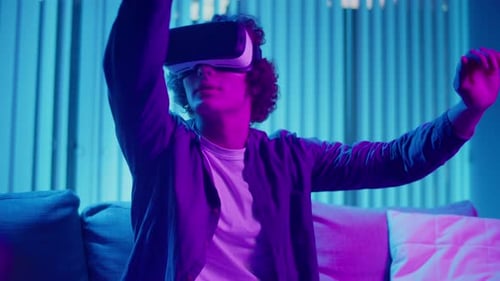 Young Adult Using Virtual Reality Headset at Home