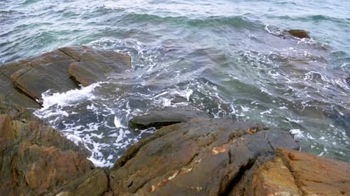 Slow motion scenic landscape of nature sea wave coast to beach with stone and rock for summer vacati