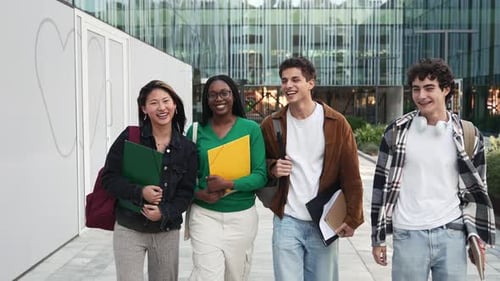 Four Multiracial Classmates Walking in the University Campus Going to the College Diversity in