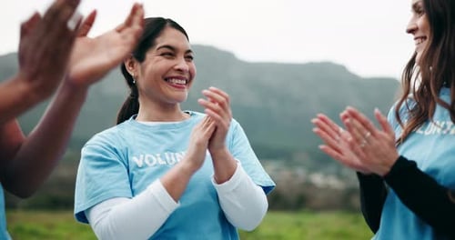 Group of Adults Clapping in a Field