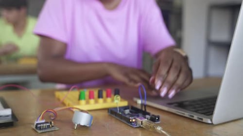 Black Female Teenager Student Programming Electronics in the Technology Course