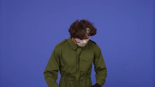 Man in White Mask with Chainsaw in Hands on Blue Background Image of Maniac Jason Voorhees From