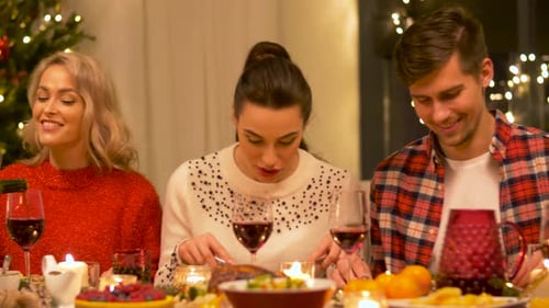 Friends Celebrate Holiday Season over Dinner and Wine