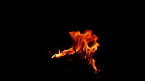 Intense Flames Flickering Against Black Background