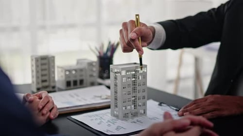 Businesspeople sell buy mortgage and signing agreement for apartment financial