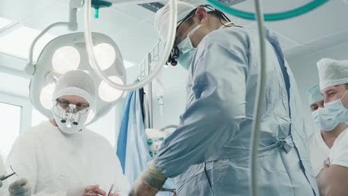 Surgical Team Operates Patient in Clinic
