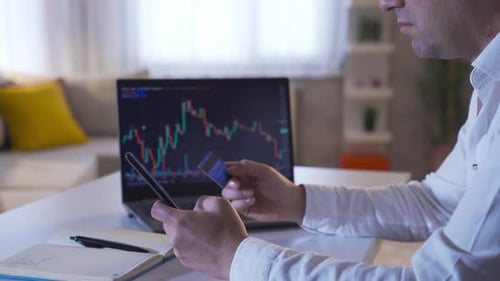 Man buying stock on credit card.