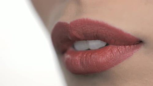 Close Up of Lipstick Application on Woman's Lips