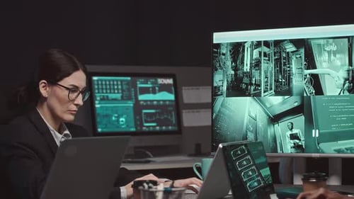 Cybersecurity Specialists Working in Agency at Night