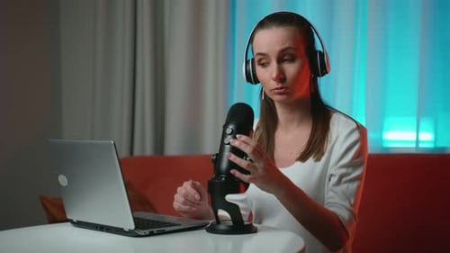Woman Recording Podcast with Microphone and Laptop