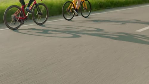 Back View of Cyclists Pedaling Racing Bicycles Outdoors