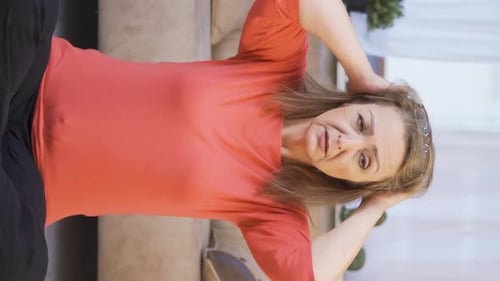 Woman Massaging Stiff Neck and Sore Shoulders