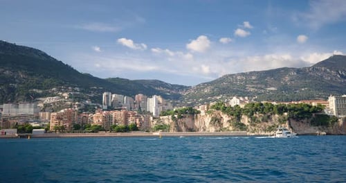 Stunning Coastal View Of Monaco Showcasing Cityscape And Mountains