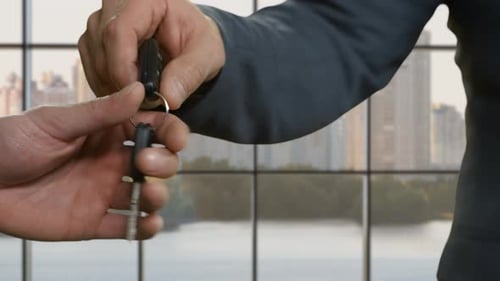 Businessmen's Hands Pass Car Key