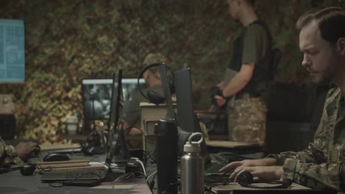 Military Surveillance Officers Working Coworking in Dark Office