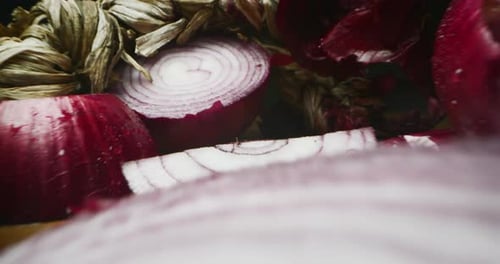 Super macro slide of a composition of red onions on a wooden table. Concept: food and drink, kitch