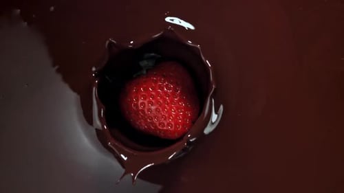 Strawberry Falls into Rich Dark Chocolate