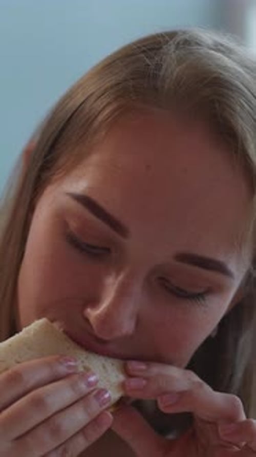 Woman Eating Sandwich Close Up Vertical Footage