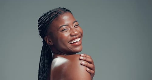 Laugh, smile and beauty with face of black woman in studio for self care, skincare and shine