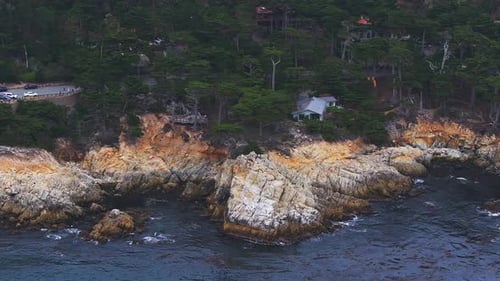 Aerial View of the Pacific Ocean Waves Hitting the Cliff Rocks