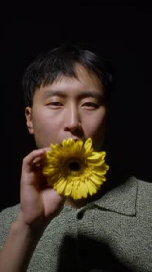 Young Adult Portrait with Yellow Flower