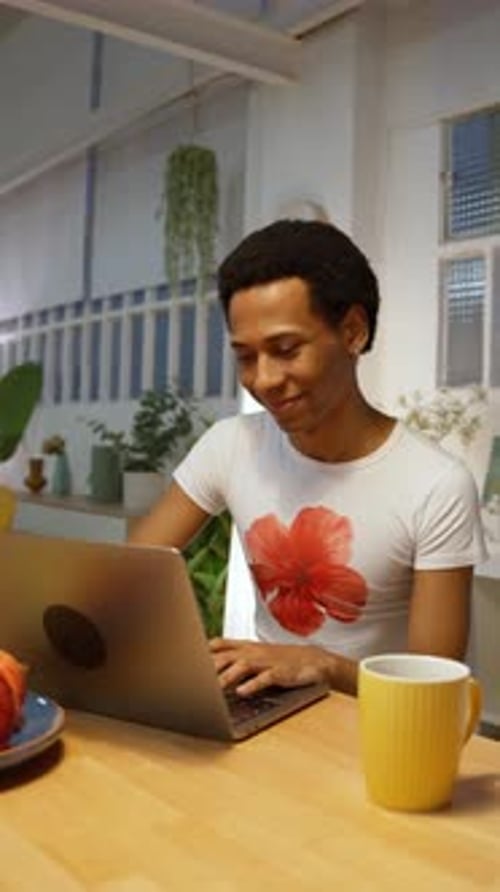 Young Man Working From Home on Laptop in Slow Motion