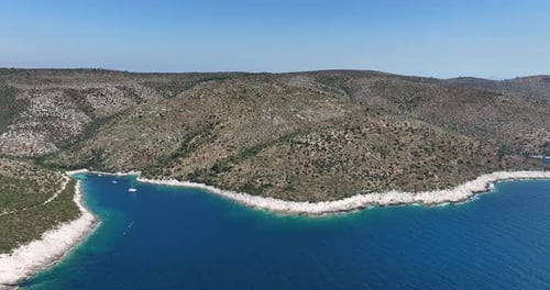 Breathtaking Aerial View of a Serene Coastline and Beautiful Blue Waters