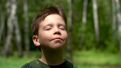 Boy Breathing In Nature