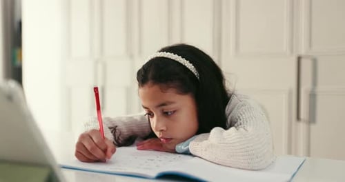 Child, student and bored with writing in house, tablet for online education or tired with book