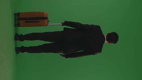 Full Body Of Back View Businessman Traveler With Luggage Walking And Standing In The Green Screen