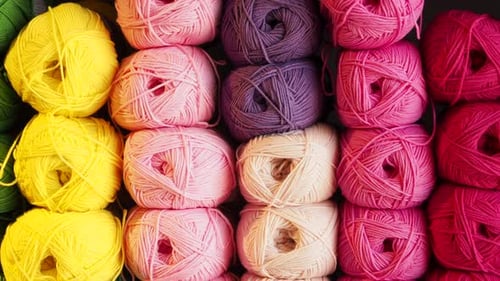 Colorful Balls of Yarn Stacked Neatly