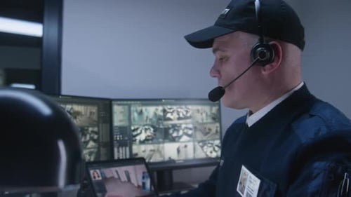 Security Operator Monitoring CCTV Cameras