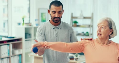 Physiotherapy, weights and man with a senior woman for rehabilitation, strong arm or exercise