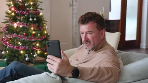 Man Video Calling During Christmas at Home