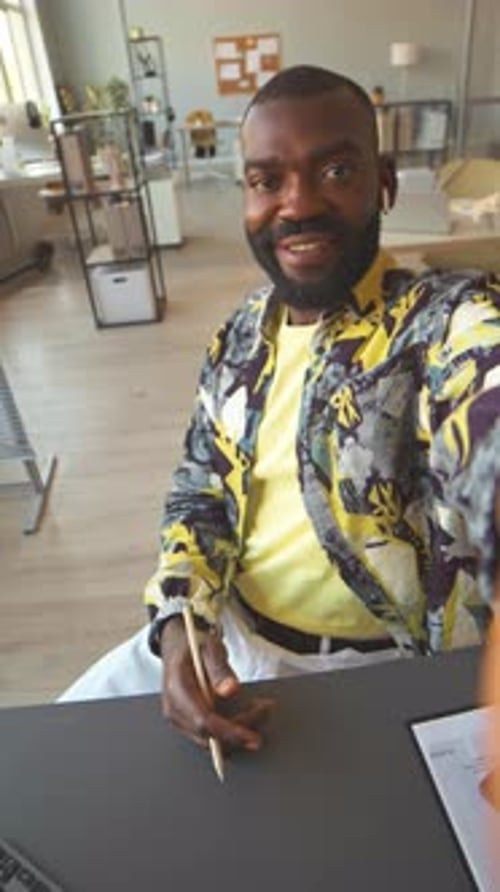 POV of African American Man Video Chatting with Colleague from Office