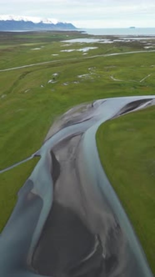 Aerial View of a Beautiful Icelandic River Flowing Through the Tundra in Arctic