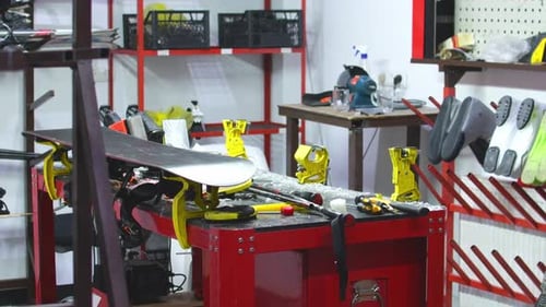 Snowboard In Messy Ski Workshop