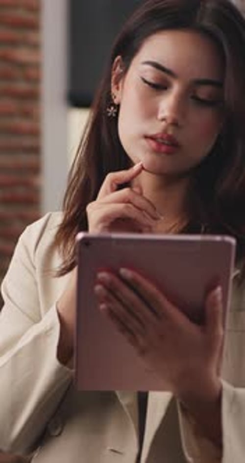 Woman Using Tablet Device in Modern Home