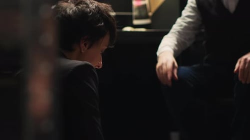 Two Colleagues Investigate Case in Dark Office