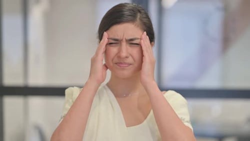 Stressed Young Adult Woman with Headache