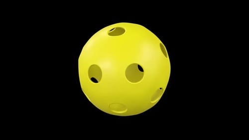 Animated Yellow Perforated Ball Spinning on a Black Background