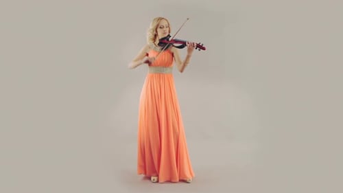 Woman Plays Modern Electric Violin in Elegant Dress