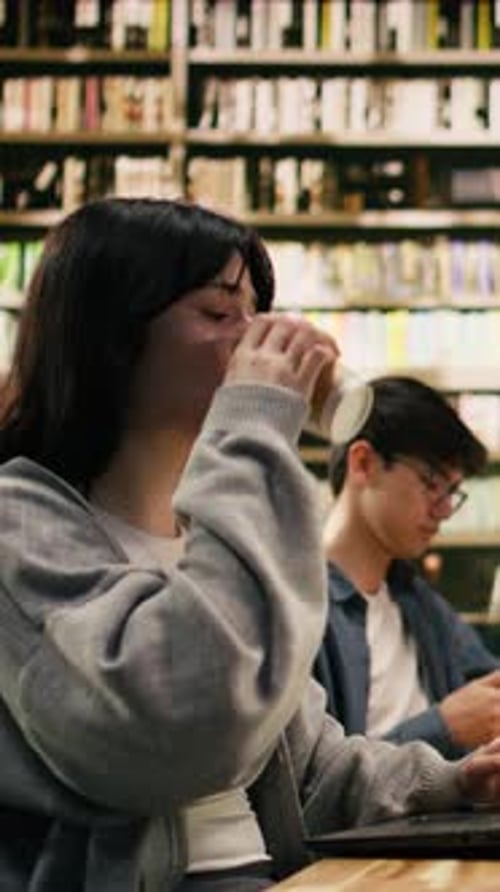 Vertical Video Frustrated Woman Student Scratching Head and Drinking Coffee