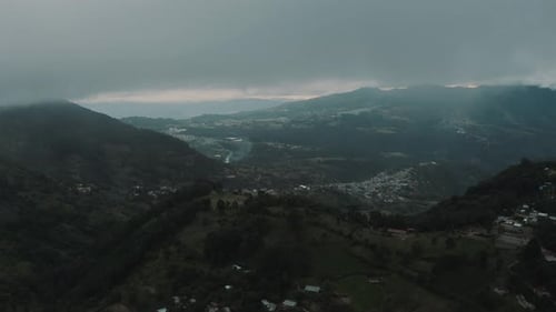 High up in the mountains during a cloudy windy day - Drone aerial landscape view