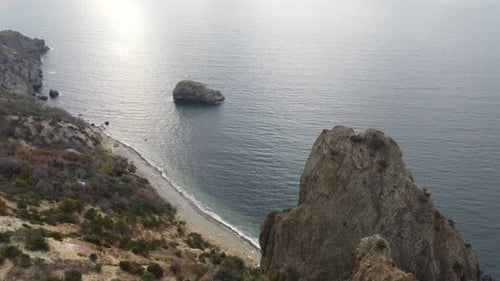 Aerial View on Calm Azure Sea and Volcanic Rocky Shores Small Waves on Water Surface Nature Summer