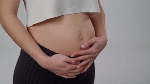 Close Up Pregnant Woman Stroking Her Belly Unrecognizable Expectant Mother Gently Caressing Her